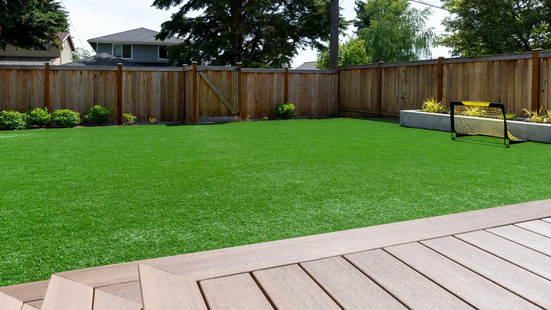 A spacious backyard turf surface with a soccer goal